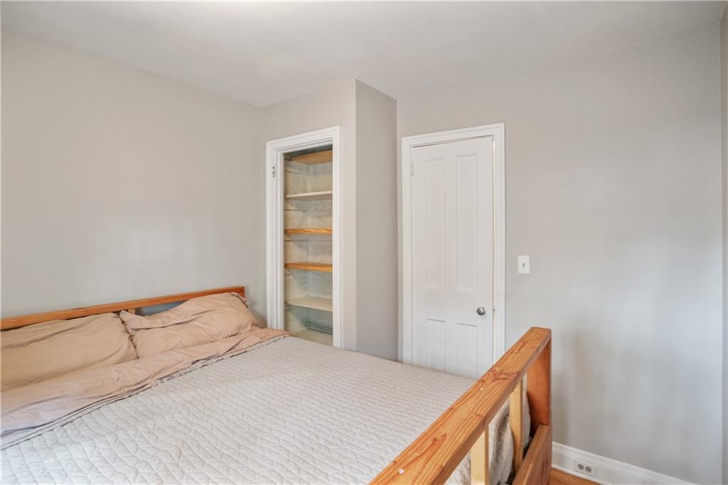 420 Sulgrave Road Pittsburgh, PA 15211 - Photo 16 of 35 a bedroom with a bed and a window