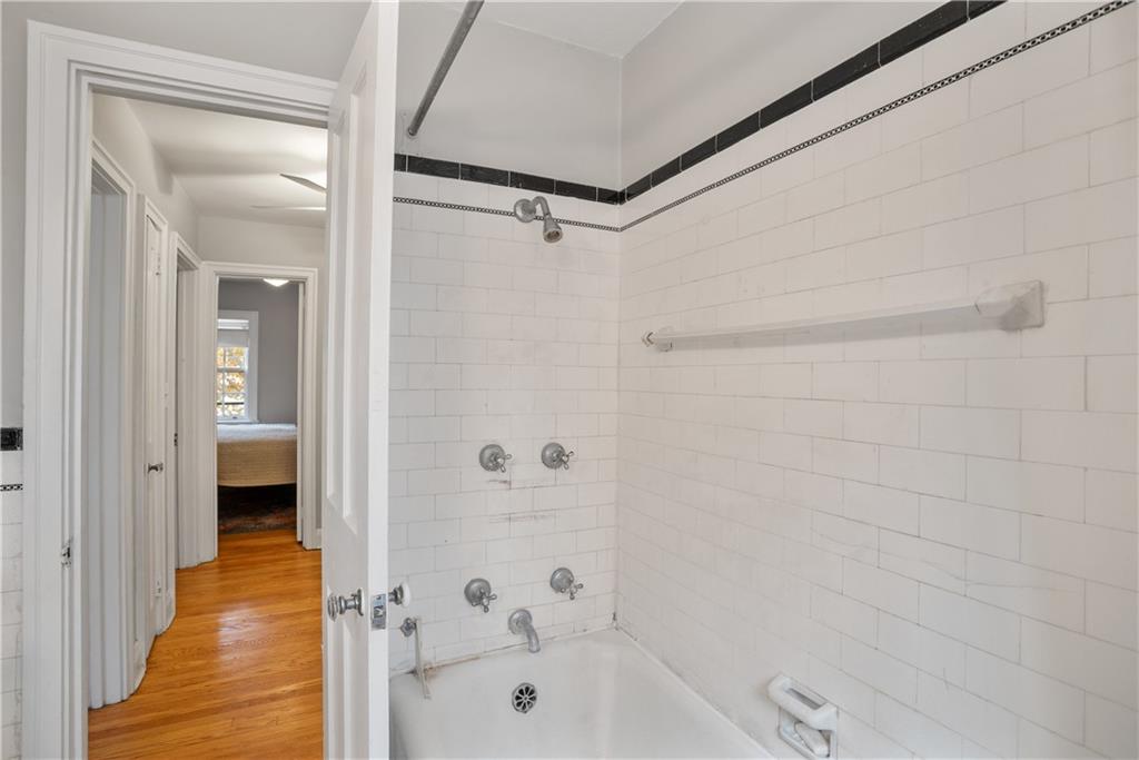 420 Sulgrave Road Pittsburgh, PA 15211 - Photo 17 of 35 a bathroom with a bathtub and a shower