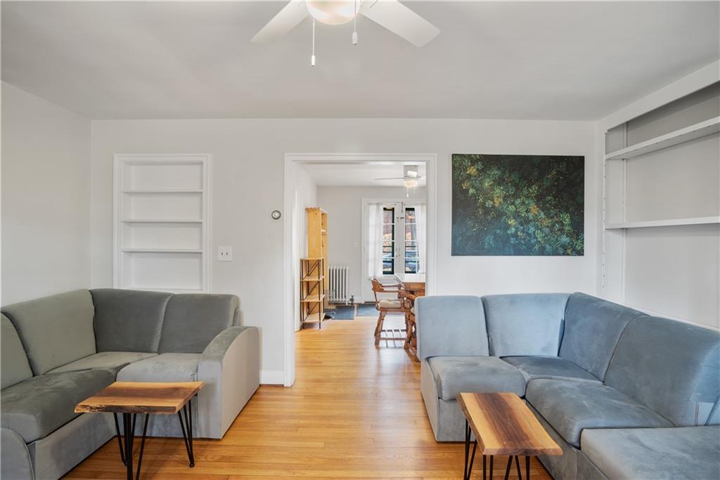 420 Sulgrave Road Pittsburgh, PA 15211 - Photo 5 of 35 a living room with furniture and a large window