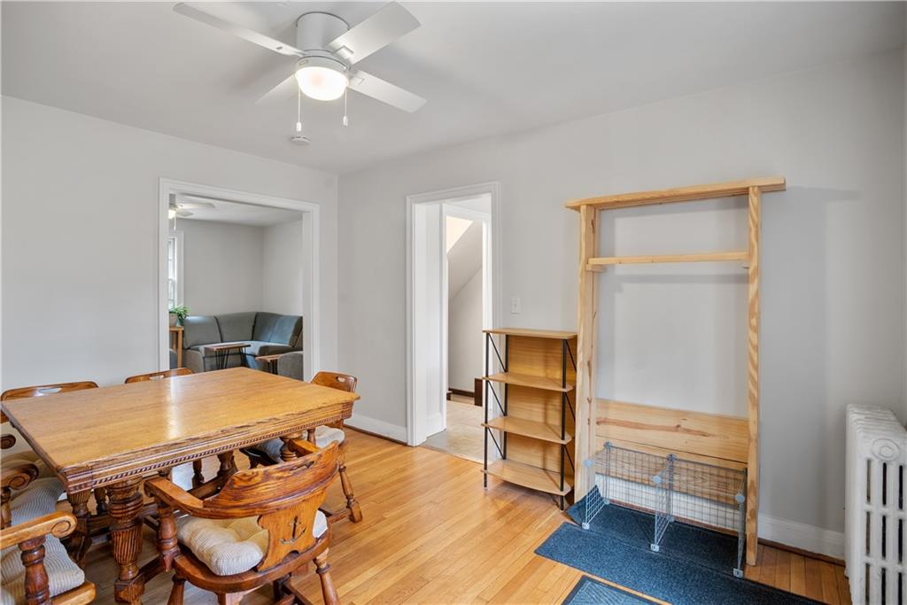 420 Sulgrave Road Pittsburgh, PA 15211 - Photo 8 of 35 a view of a dining room with furniture and wooden floor