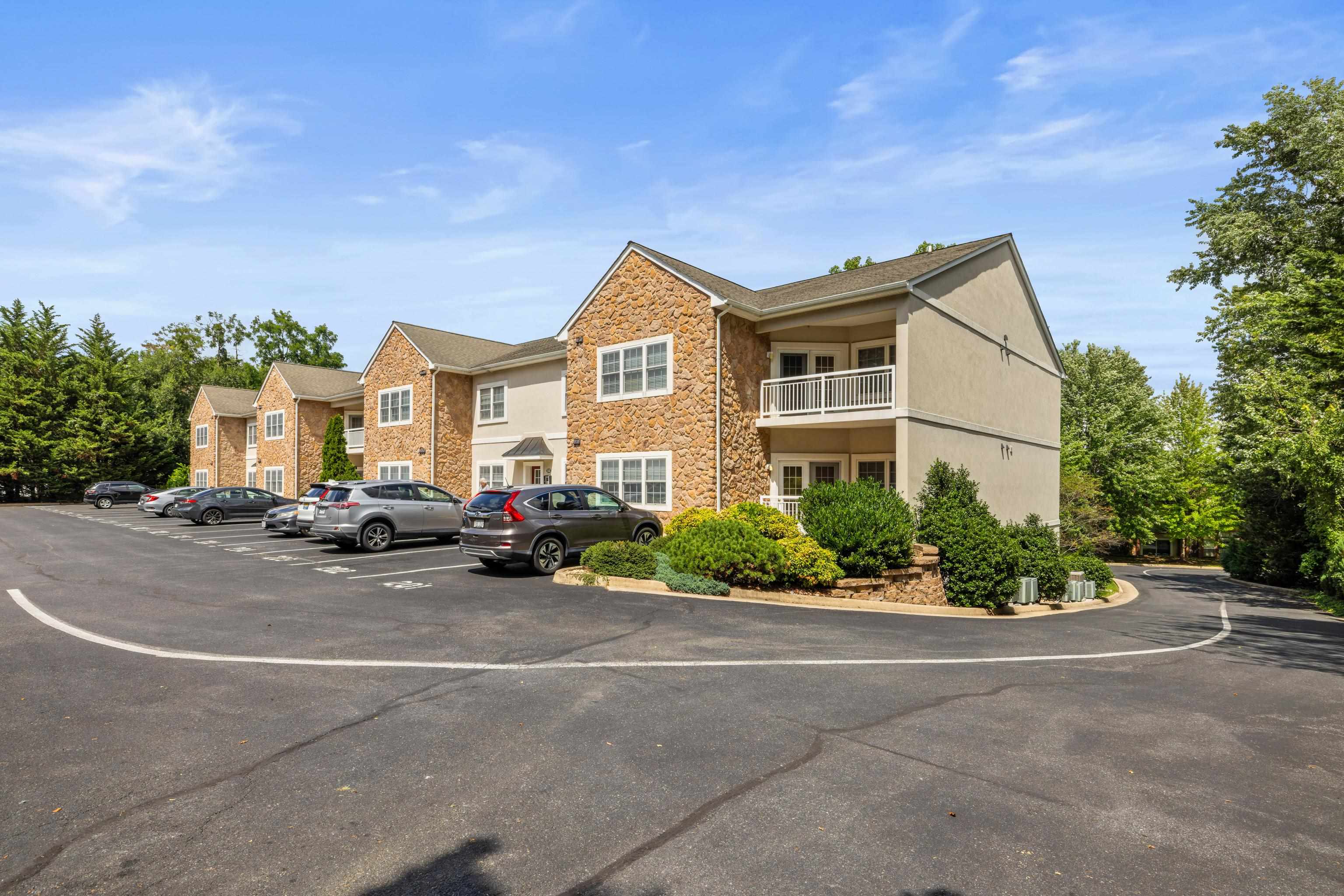1410 North Coalter Street, Unit 202 Staunton, VA 24401 - Photo 1 of 52 a view of a car park in front of a house