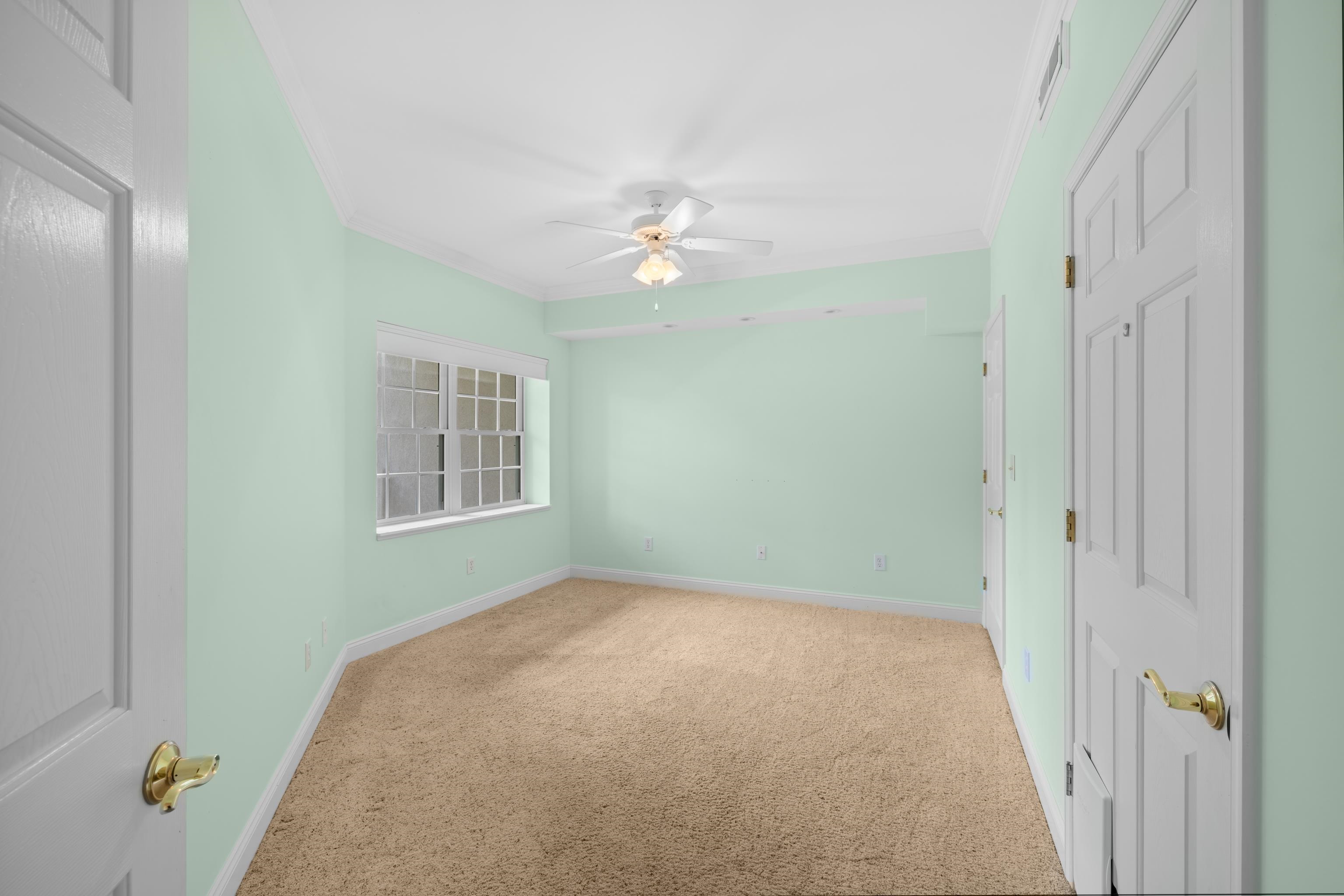 1410 North Coalter Street, Unit 202 Staunton, VA 24401 - Photo 34 of 52 a view of a bedroom with a ceiling fan and a window