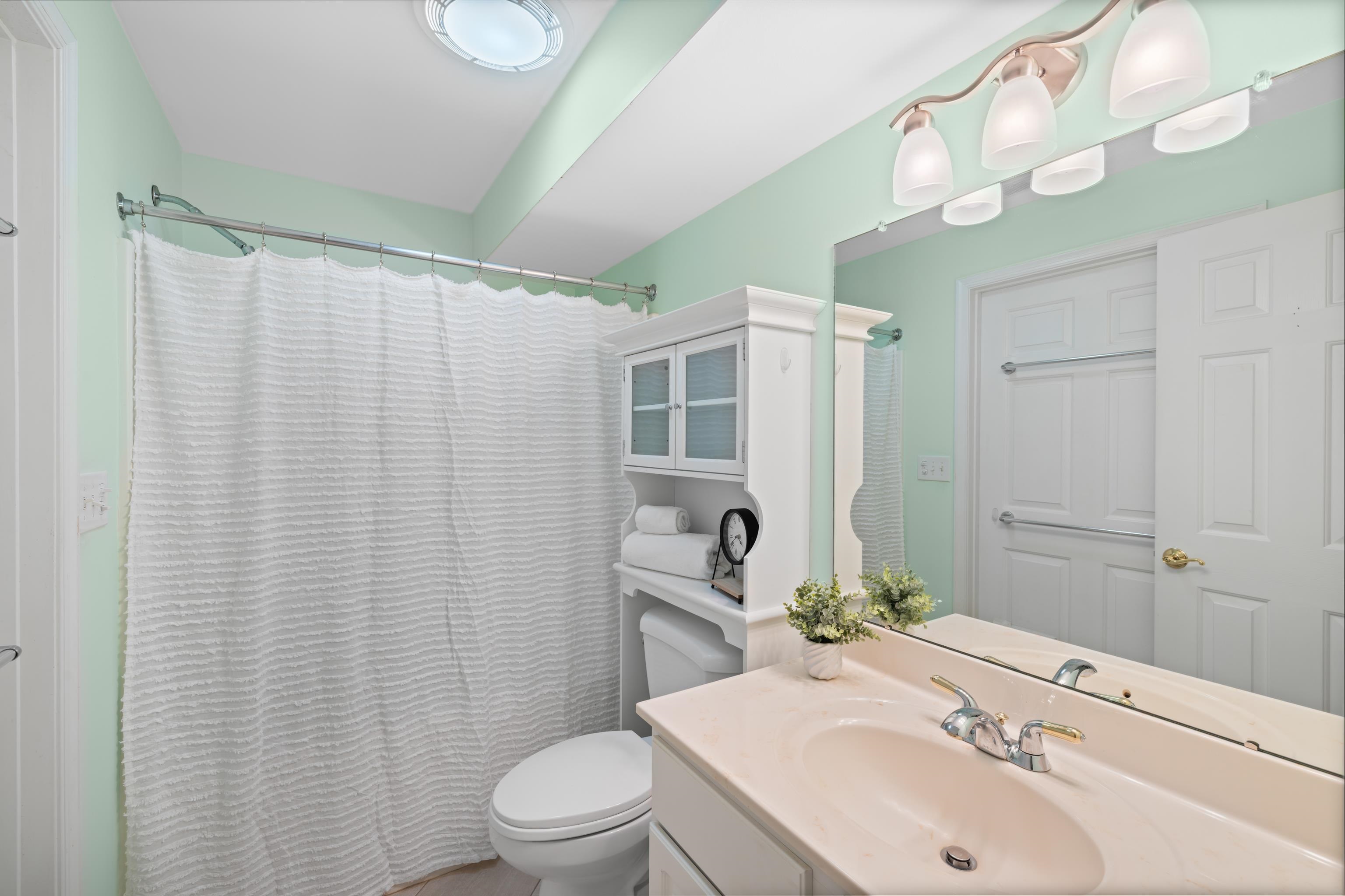1410 North Coalter Street, Unit 202 Staunton, VA 24401 - Photo 36 of 52 a bathroom with a sink a toilet and shower curtain