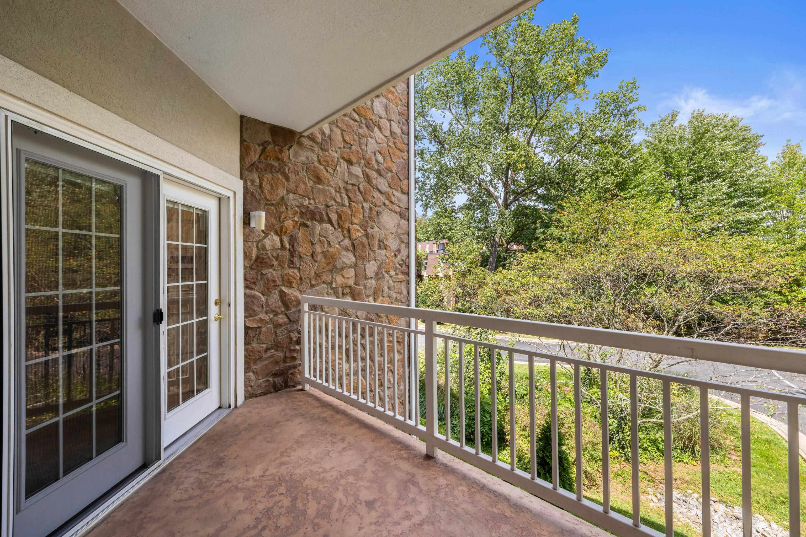 1410 North Coalter Street, Unit 202 Staunton, VA 24401 - Photo 41 of 52 a view of a balcony with a tree