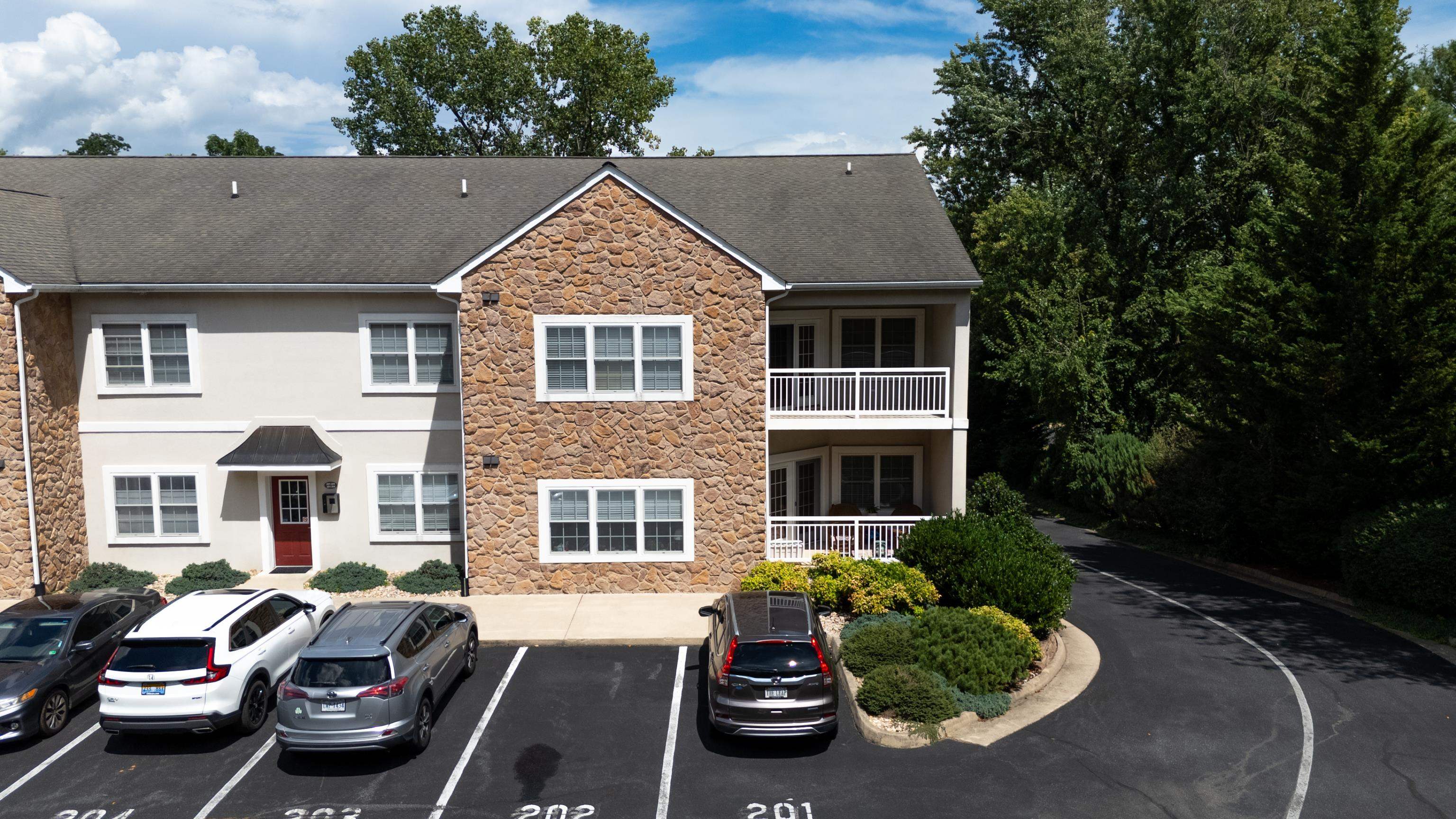 1410 North Coalter Street, Unit 202 Staunton, VA 24401 - Photo 47 of 52 a front view of a house with a garden