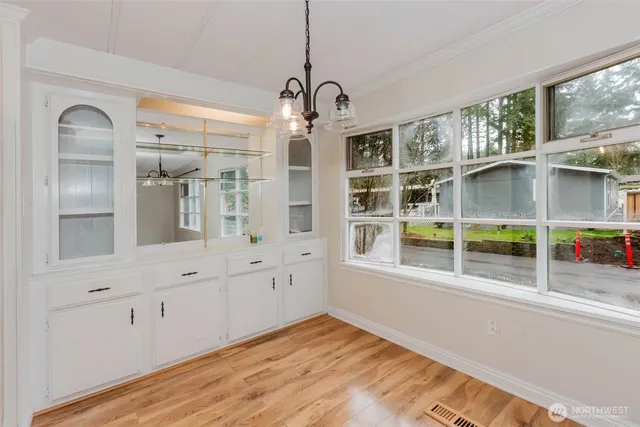 a kitchen with stainless steel appliances a stove a microwave and sink