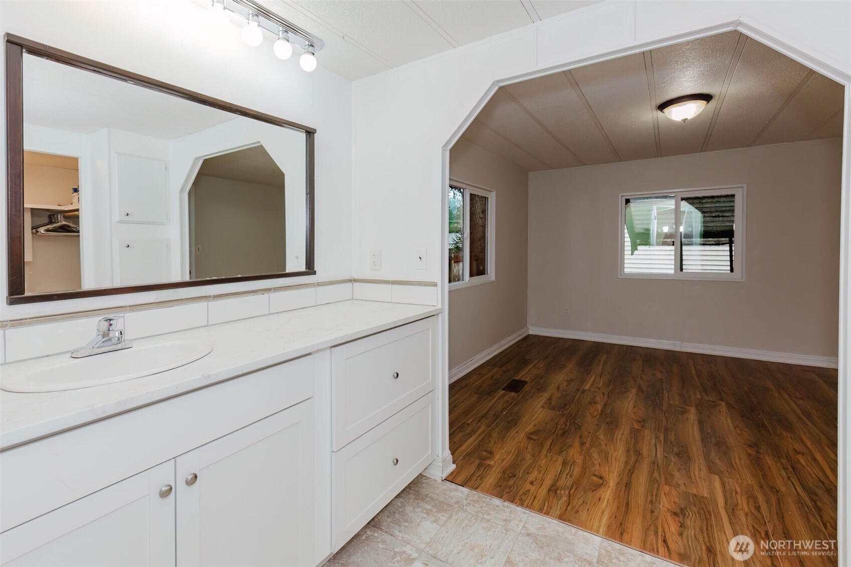 2535 70th Avenue Southwest, Unit 12 Tumwater, WA 98512 - Photo 17 of 33 a bathroom with a sink and a mirror