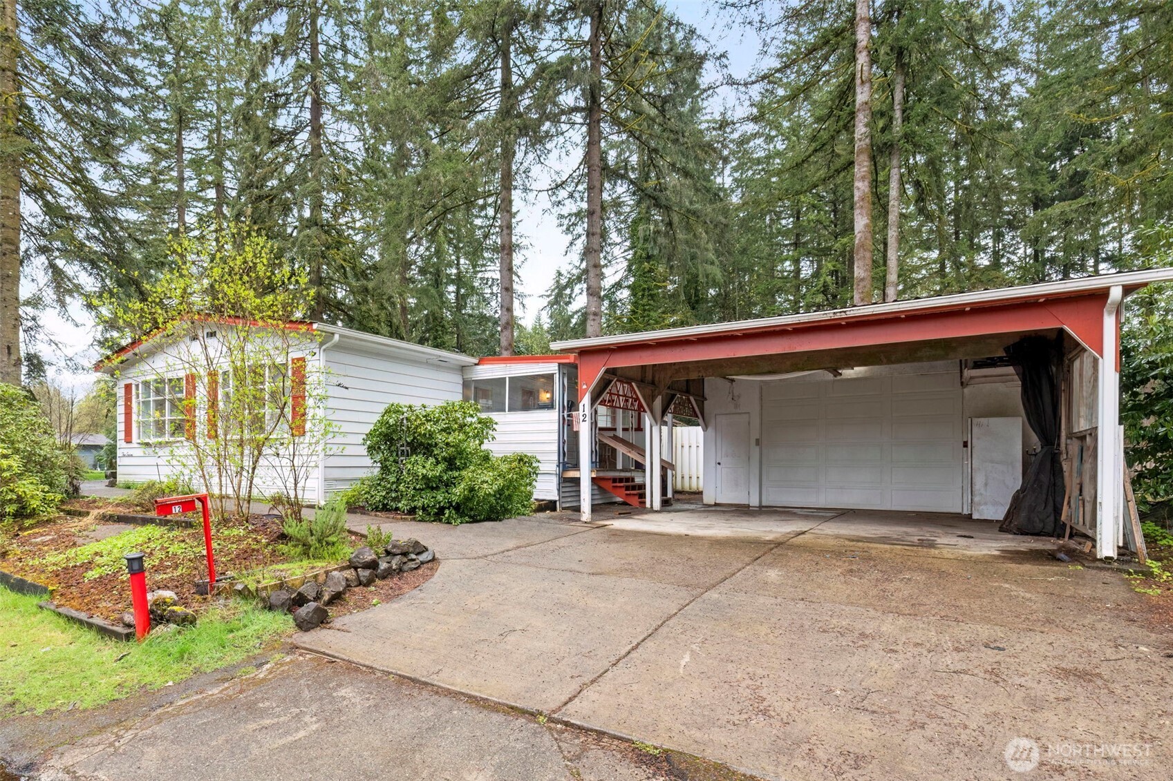 2535 70th Avenue Southwest, Unit 12 Tumwater, WA 98512 - Photo 2 of 33 a view of a house with a yard