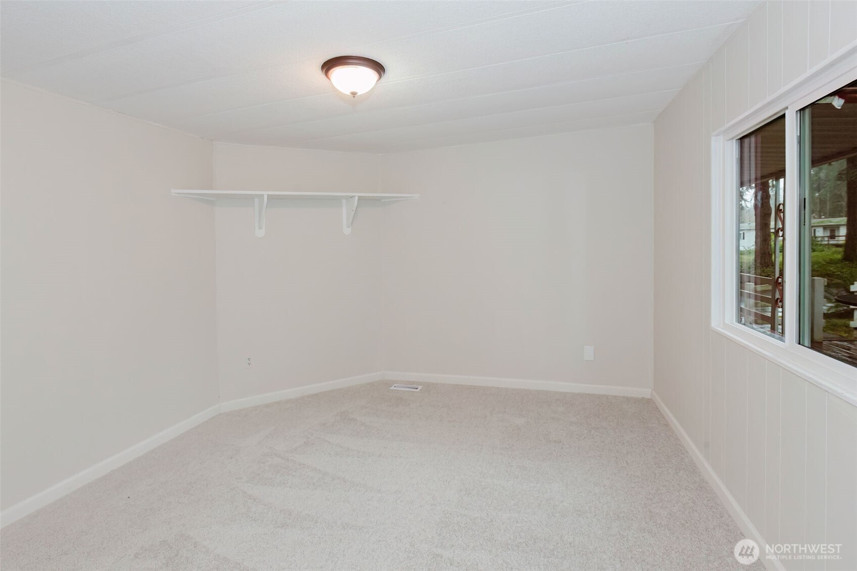 2535 70th Avenue Southwest, Unit 12 Tumwater, WA 98512 - Photo 26 of 33 a view of an empty room with a window
