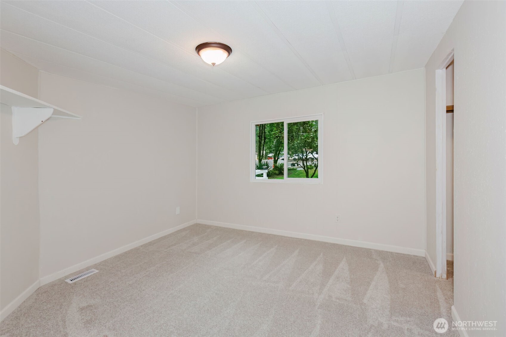 2535 70th Avenue Southwest, Unit 12 Tumwater, WA 98512 - Photo 27 of 33 an empty room with a window