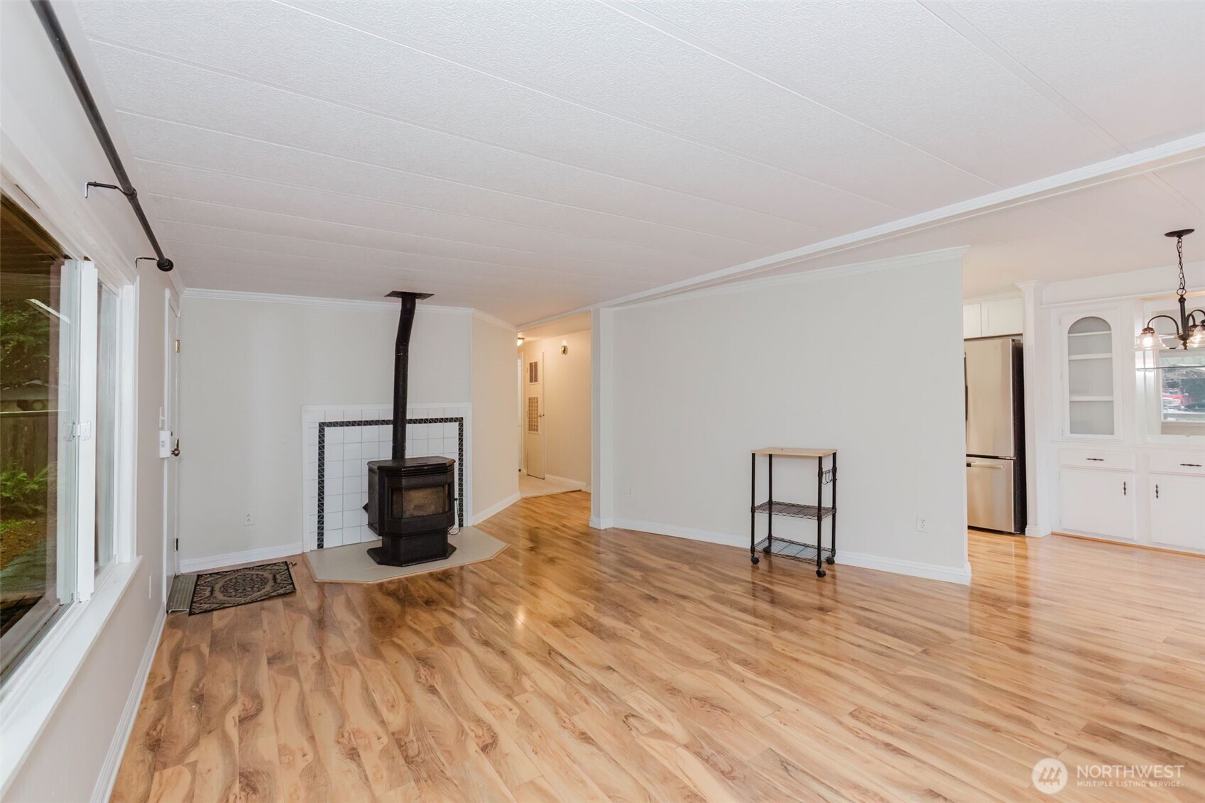 2535 70th Avenue Southwest, Unit 12 Tumwater, WA 98512 - Photo 4 of 33 a view of empty room with wooden floor and fan