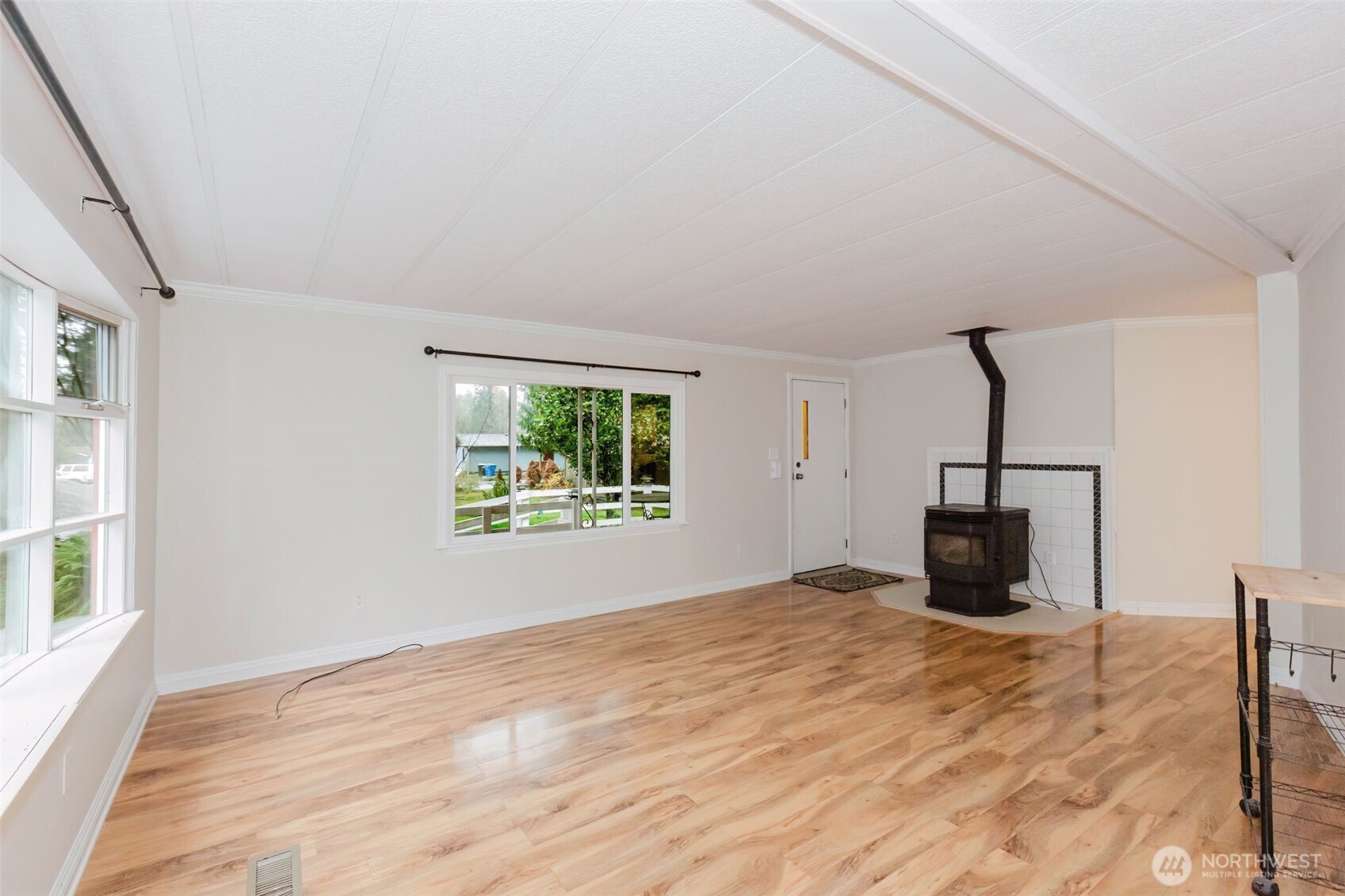 2535 70th Avenue Southwest, Unit 12 Tumwater, WA 98512 - Photo 5 of 33 a view of empty room with wooden floor and fan