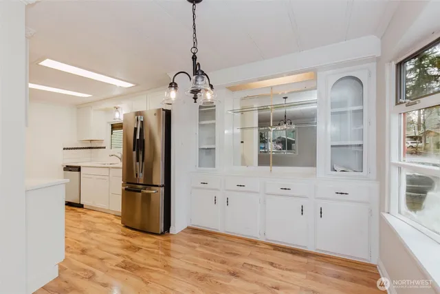 a kitchen with stainless steel appliances a refrigerator stove and sink