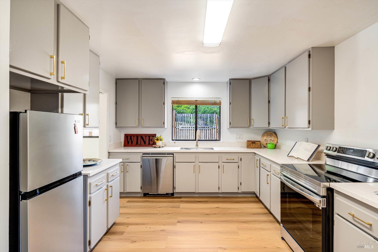 168 Ridgecrest Drive Napa, CA 94558 - Photo 12 of 39 a kitchen with a white cabinets and white appliances