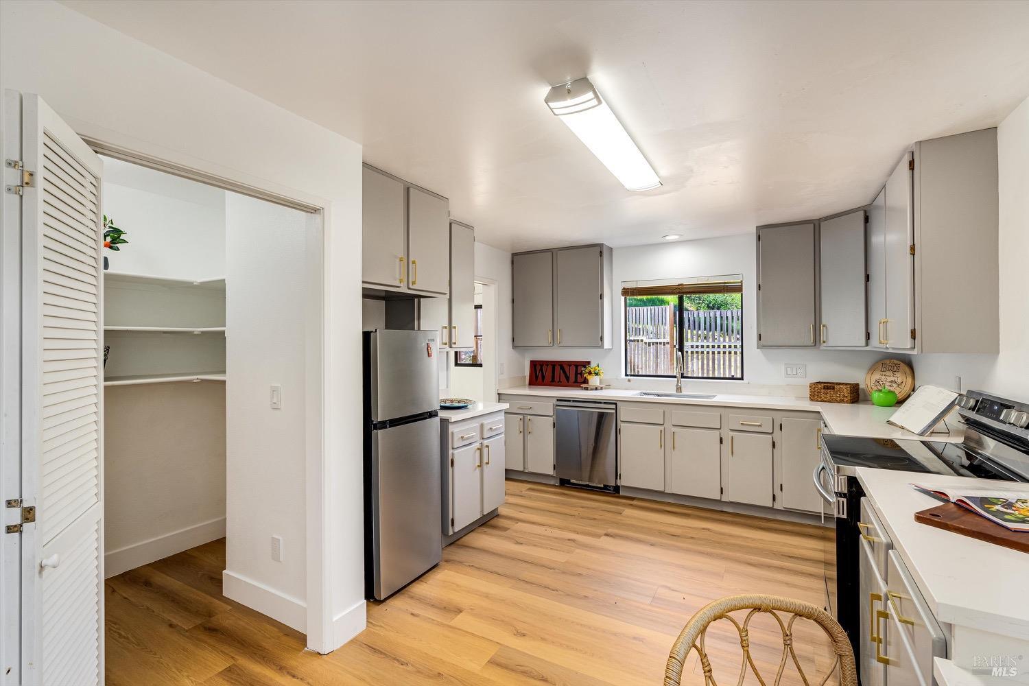 168 Ridgecrest Drive Napa, CA 94558 - Photo 13 of 39 a kitchen with stainless steel appliances granite countertop a refrigerator and a stove top oven