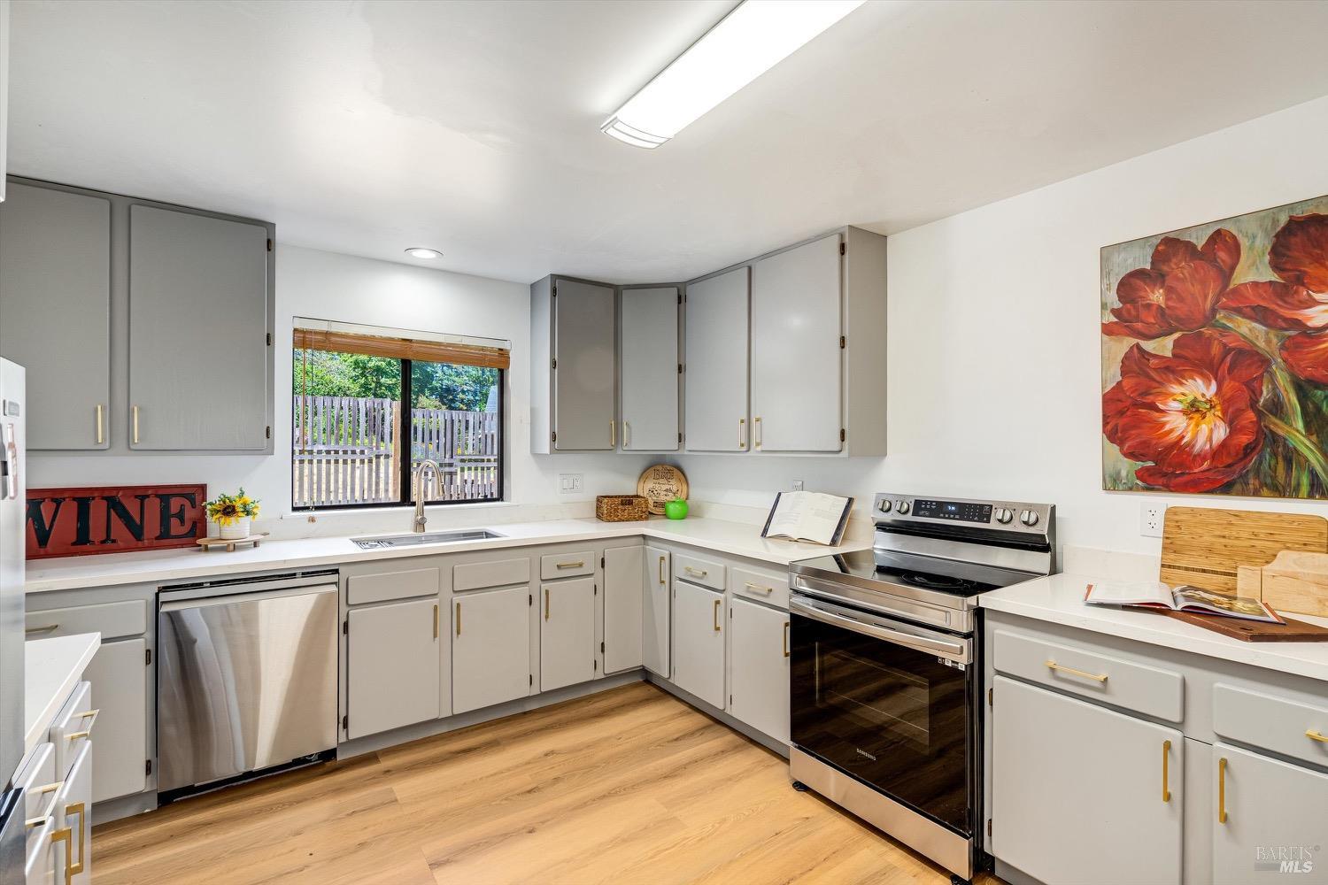 168 Ridgecrest Drive Napa, CA 94558 - Photo 14 of 39 a kitchen that has a sink and a stove in it