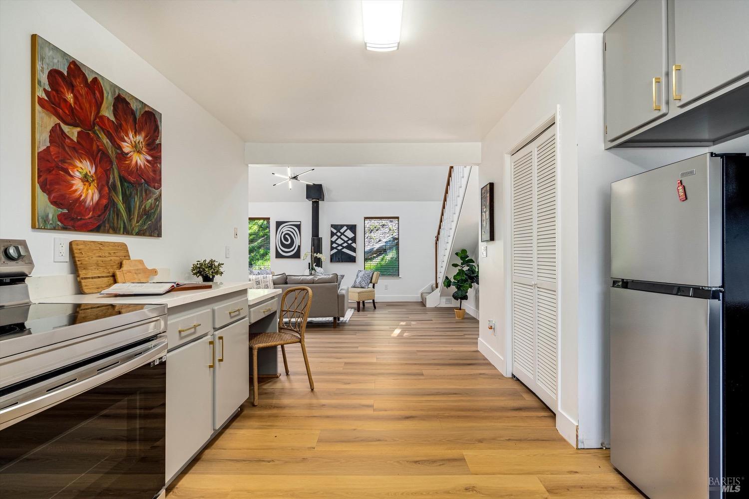 168 Ridgecrest Drive Napa, CA 94558 - Photo 20 of 39 a kitchen with a refrigerator and a stove top open