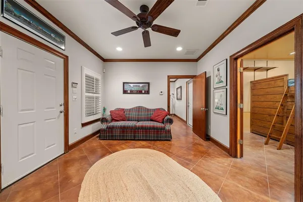 a spacious bedroom with a bed and a couch