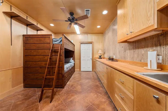 a view of walk in closet and kitchen