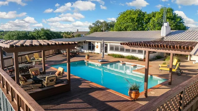 an outdoor sitting area with furniture