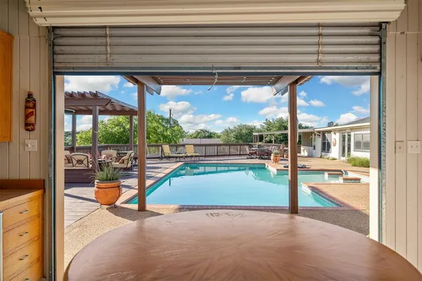 a view of a living room and a floor to ceiling window