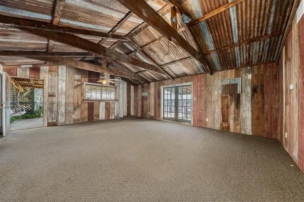 a view of an empty room with windows