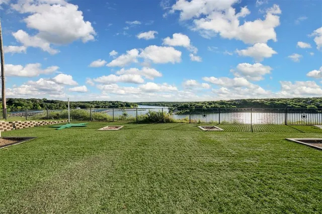 an aerial view of a house with lake view