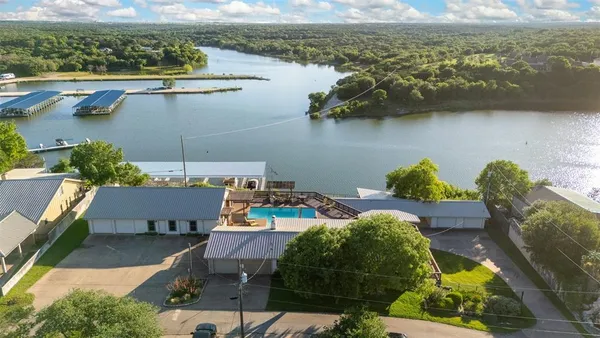 an aerial view of a house with lake view