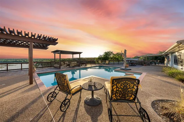 a terrace with outdoor seating and city view