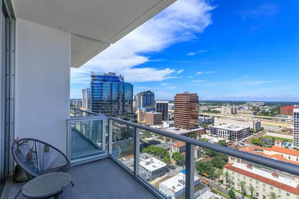 a view of a balcony with city view