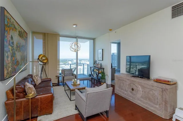 a living room with furniture and a flat screen tv