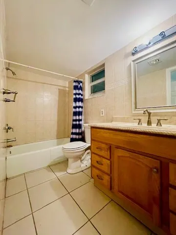 a utility room with sink dryer and washer