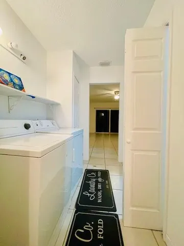 a view of a livingroom with an empty space and a window