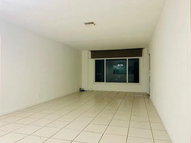 a view of kitchen with stainless steel appliances granite countertop refrigerator sink and stove