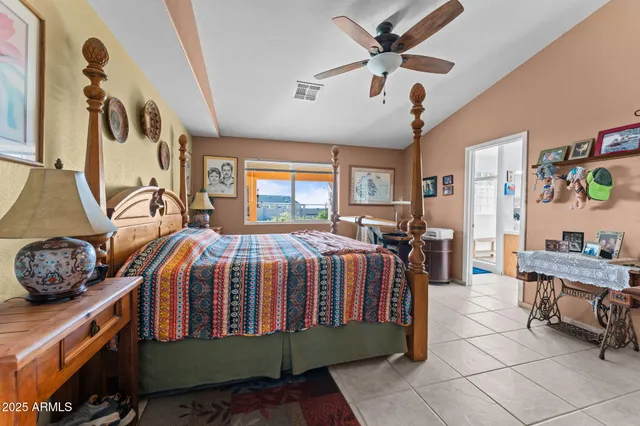 a bed room with a bed and a desk