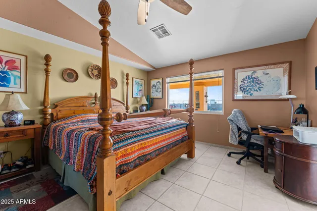 a room with stainless steel appliances a sink dishwasher and a dining table with wooden floor