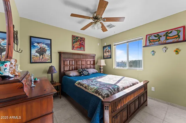 a bathroom with a sink a toilet and a large mirror