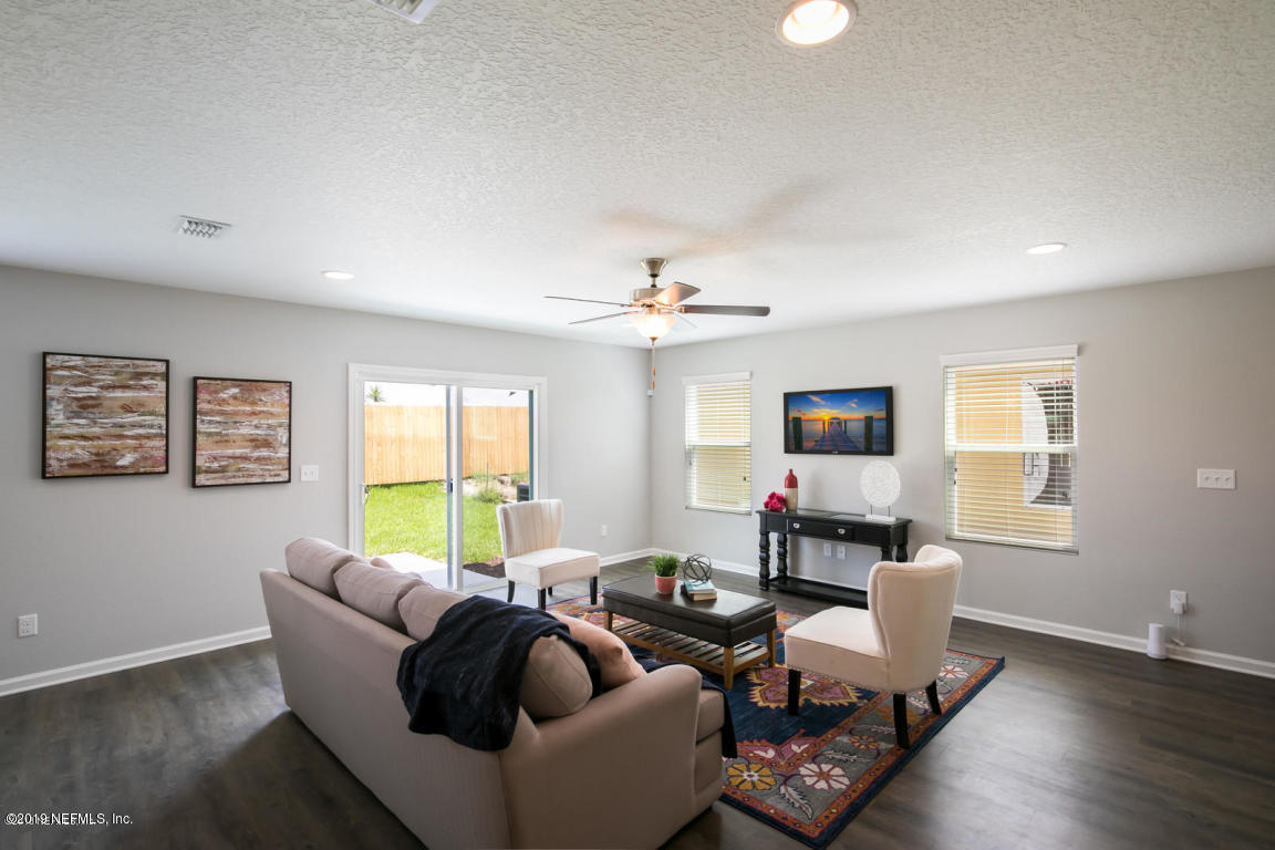 2247 Bayview Road Jacksonville, FL 32210 - Photo 2 of 11 a living room with furniture and a wooden floor