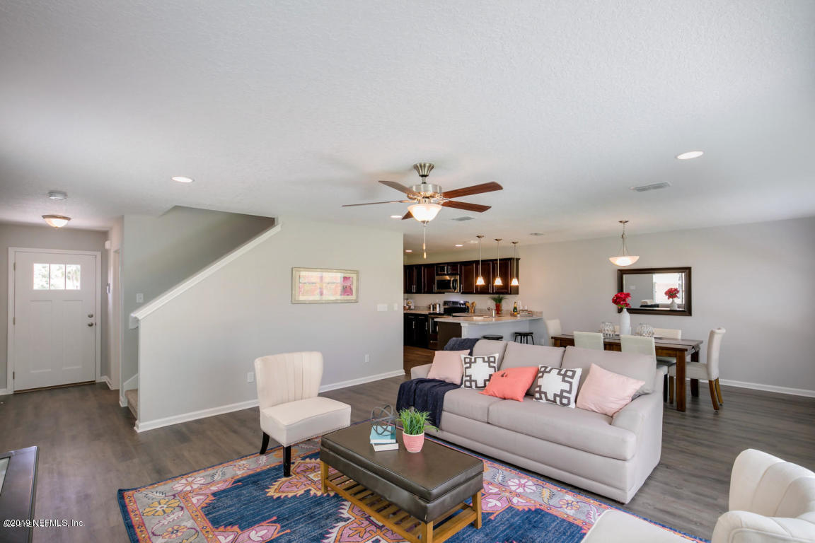2247 Bayview Road Jacksonville, FL 32210 - Photo 3 of 11 a living room with furniture or wooden floor and a ceiling fan