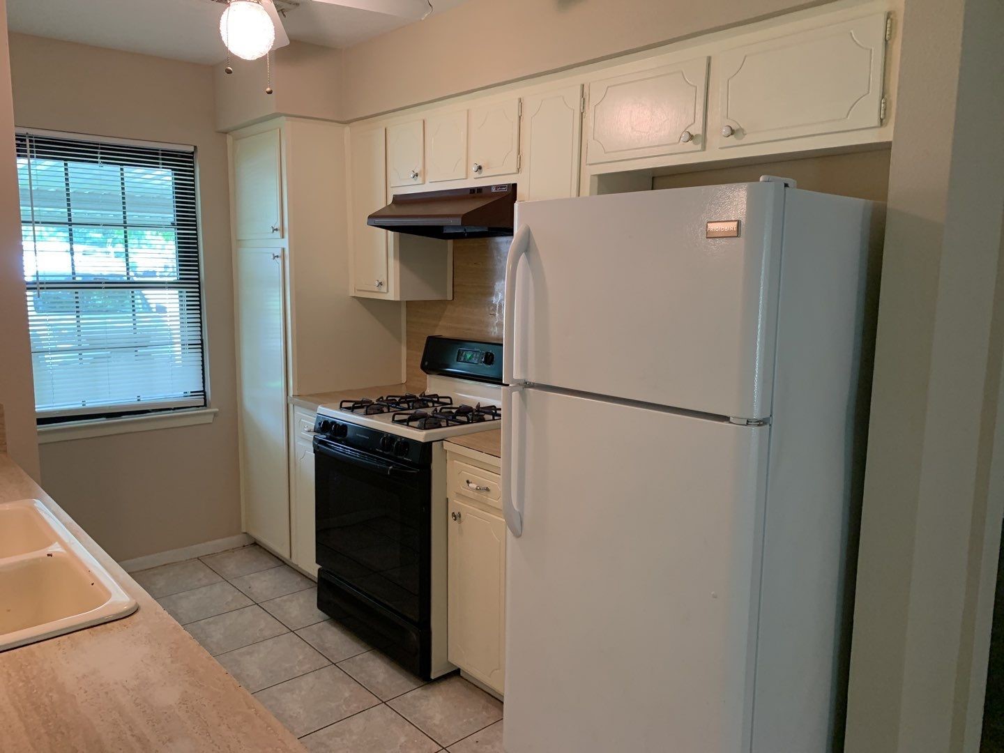 618 Overbluff Street Channelview, TX 77530 - Photo 19 of 32 a kitchen with stainless steel appliances a refrigerator and a stove top oven