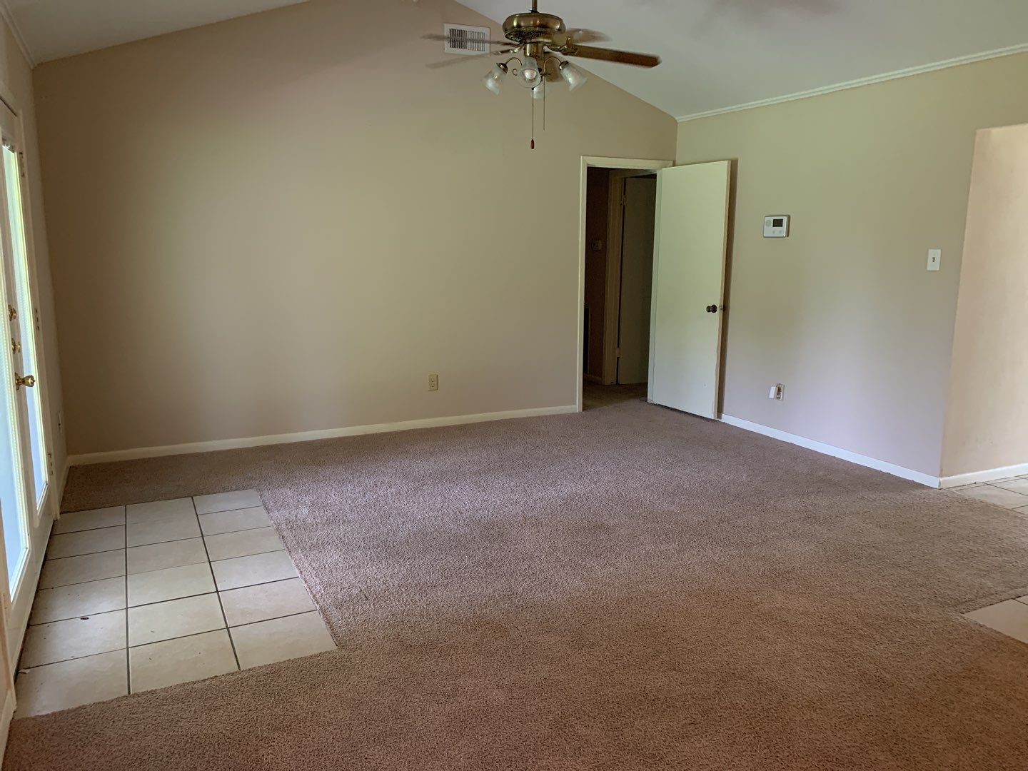 618 Overbluff Street Channelview, TX 77530 - Photo 21 of 32 an empty room with a ceiling fan and a window