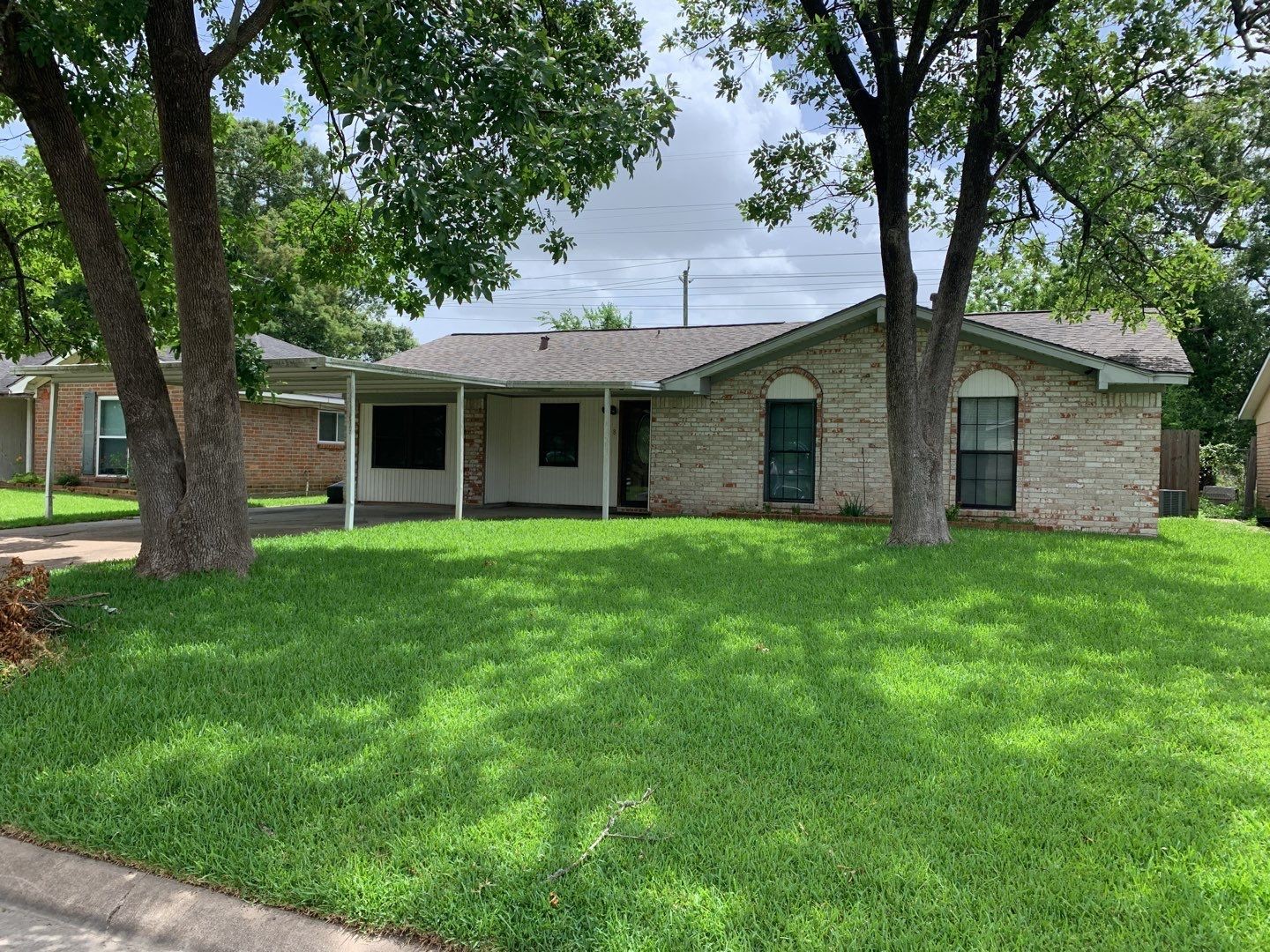 618 Overbluff Street Channelview, TX 77530 - Photo 25 of 32 a front view of house with yard and green space
