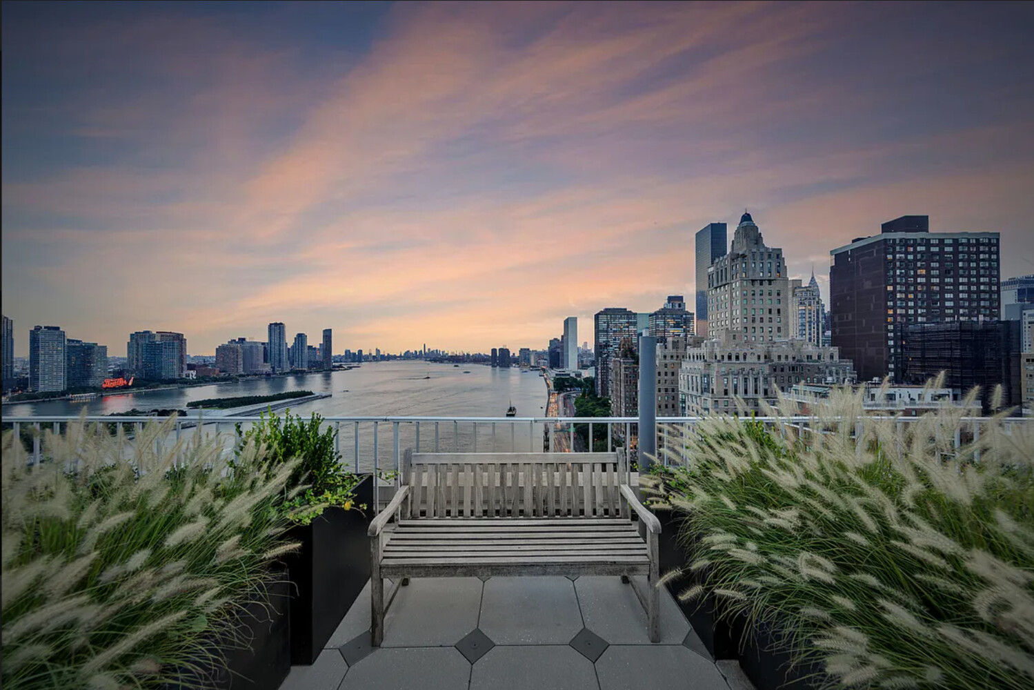 45 Sutton Place South, Unit 11J Manhattan, NY 10022 - Photo 12 of 19 a view of a city with tall buildings