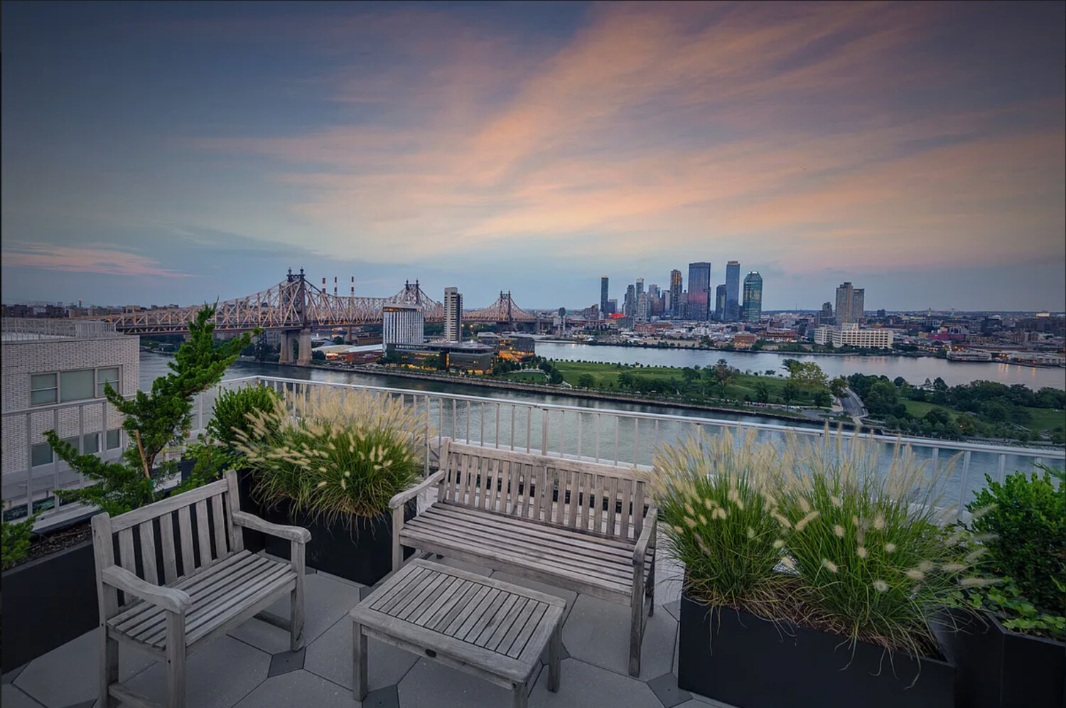 45 Sutton Place South, Unit 11J Manhattan, NY 10022 - Photo 13 of 19 a view of a chair and table on the terrace