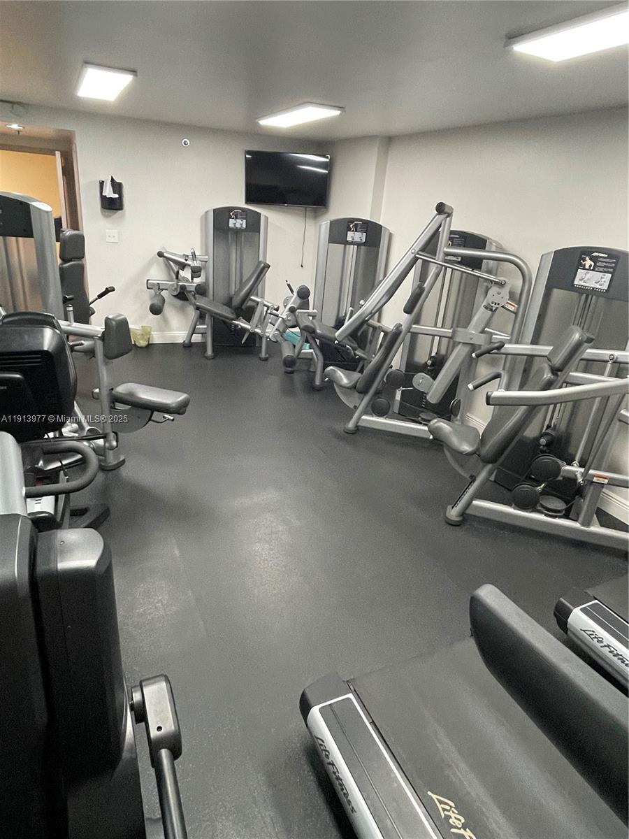 919 Hillcrest Drive, Unit 704 Hollywood, FL 33021 - Photo 15 of 43 a view of a room with gym equipment