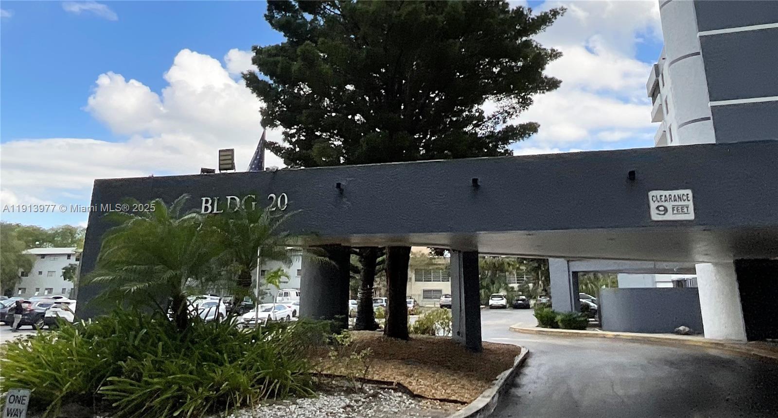 919 Hillcrest Drive, Unit 704 Hollywood, FL 33021 - Photo 18 of 43 a front view of a building with garden