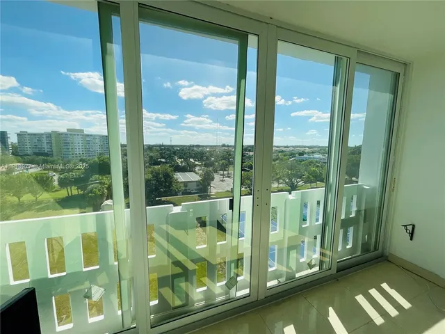 a view of a bathroom with a glass door