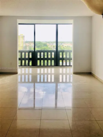 a bathroom with a sink a toilet a mirror and shower