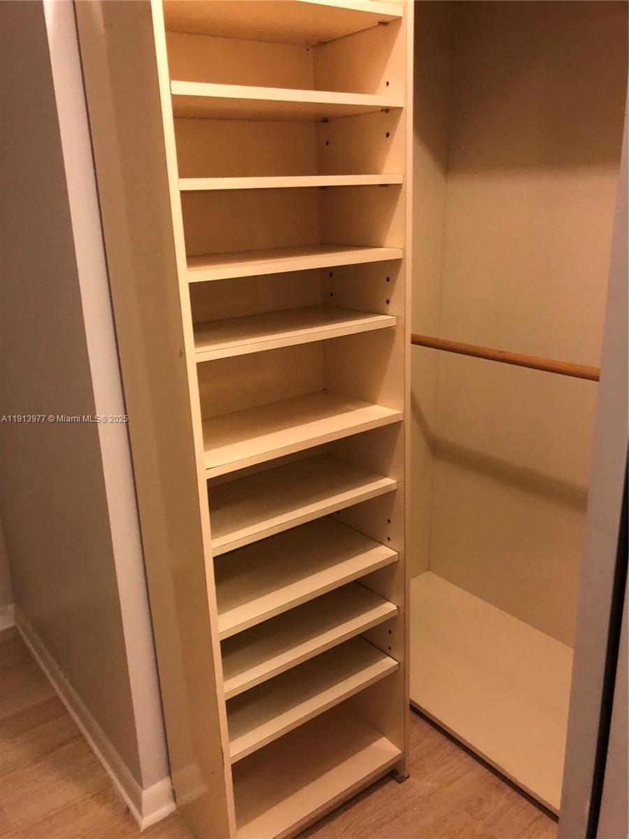 919 Hillcrest Drive, Unit 704 Hollywood, FL 33021 - Photo 40 of 43 a view of walk in closet with empty racks