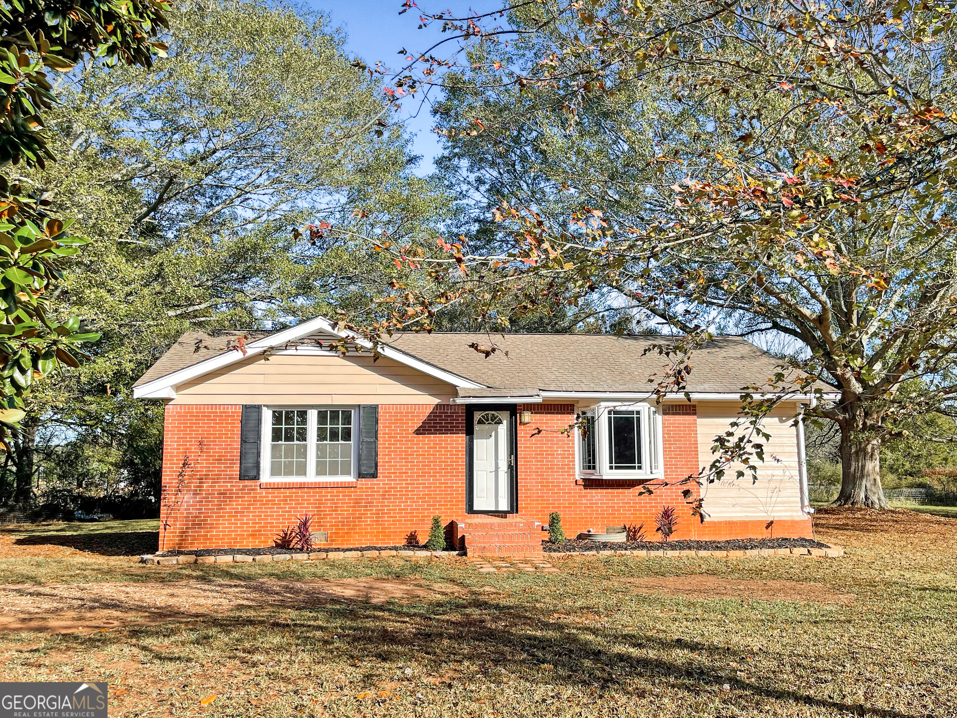 399 Friendship Church Road Southwest Monroe, GA 30656 - Photo 1 of 1 a front view of a house with a yard